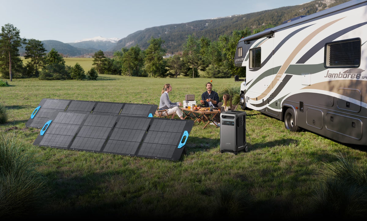Portable power and solar panels beside a recreational vehicle